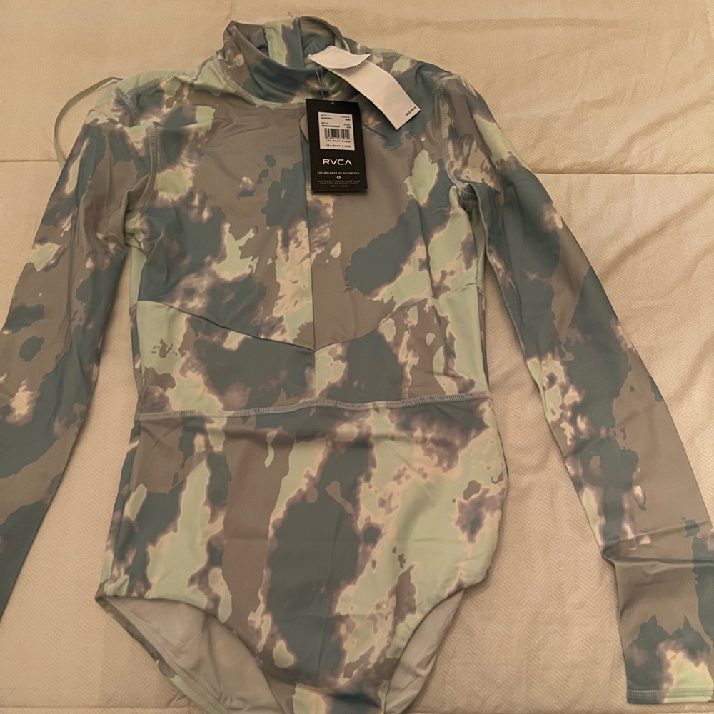 Brand new long sleeve rashguard swim suit with tags.